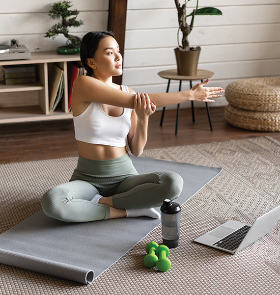 Woman doing yoga exercise to prevent COPD flare-ups.